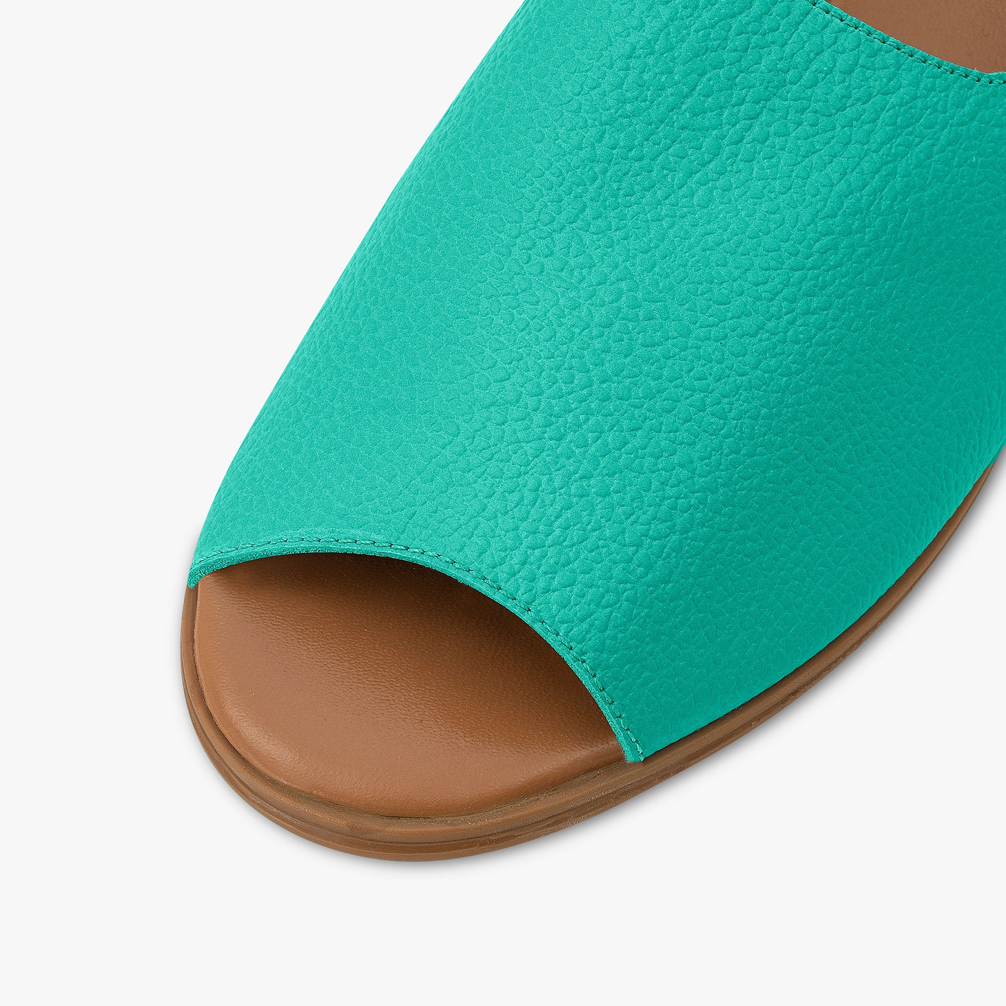 Teal sandal with brown sole on a white background