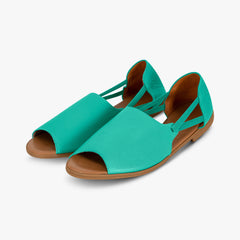 Pair of teal sandals with brown soles on a light gray background