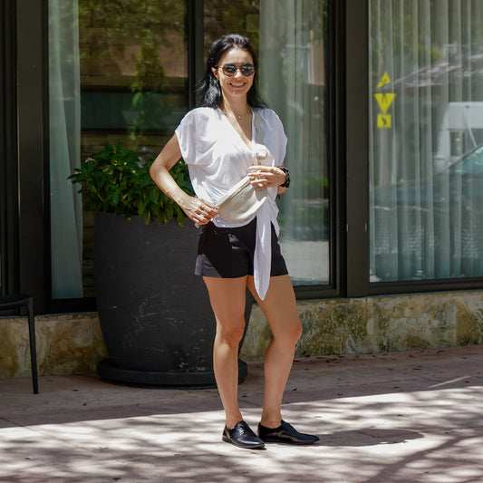 Happy Woman wearing black oxford shoes