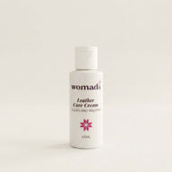 Bottle of Womads Leather Care Cream on a light background