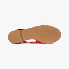 Red sandal with a tan sole on a white background