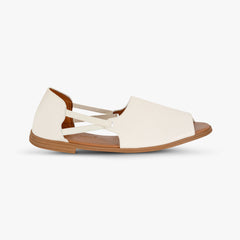 White sandal with brown sole on a white background