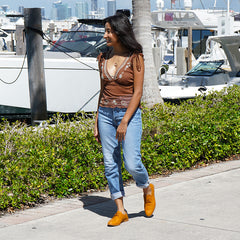 Woman wearing tan oxford shoes