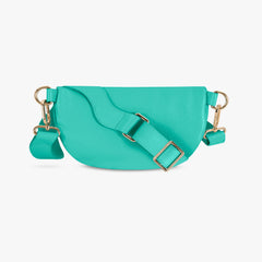 Turquoise handbag with gold accents on a white background
