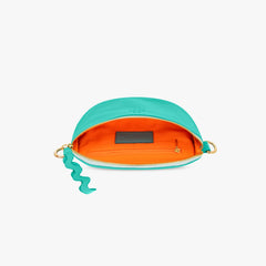 Turquoise crossbody pouch with orange interior on a white background