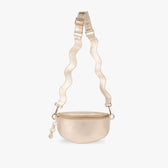 Gold metallic fanny pack with a textured strap on a white background