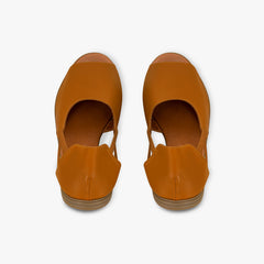 Pair of brown open-toe shoes on a white background