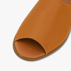 Close-up of a brown open-toe sandal on a white background