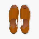 Pair of brown open-toe shoes on a white background