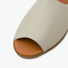 green and cream sandals peep toe leather close up