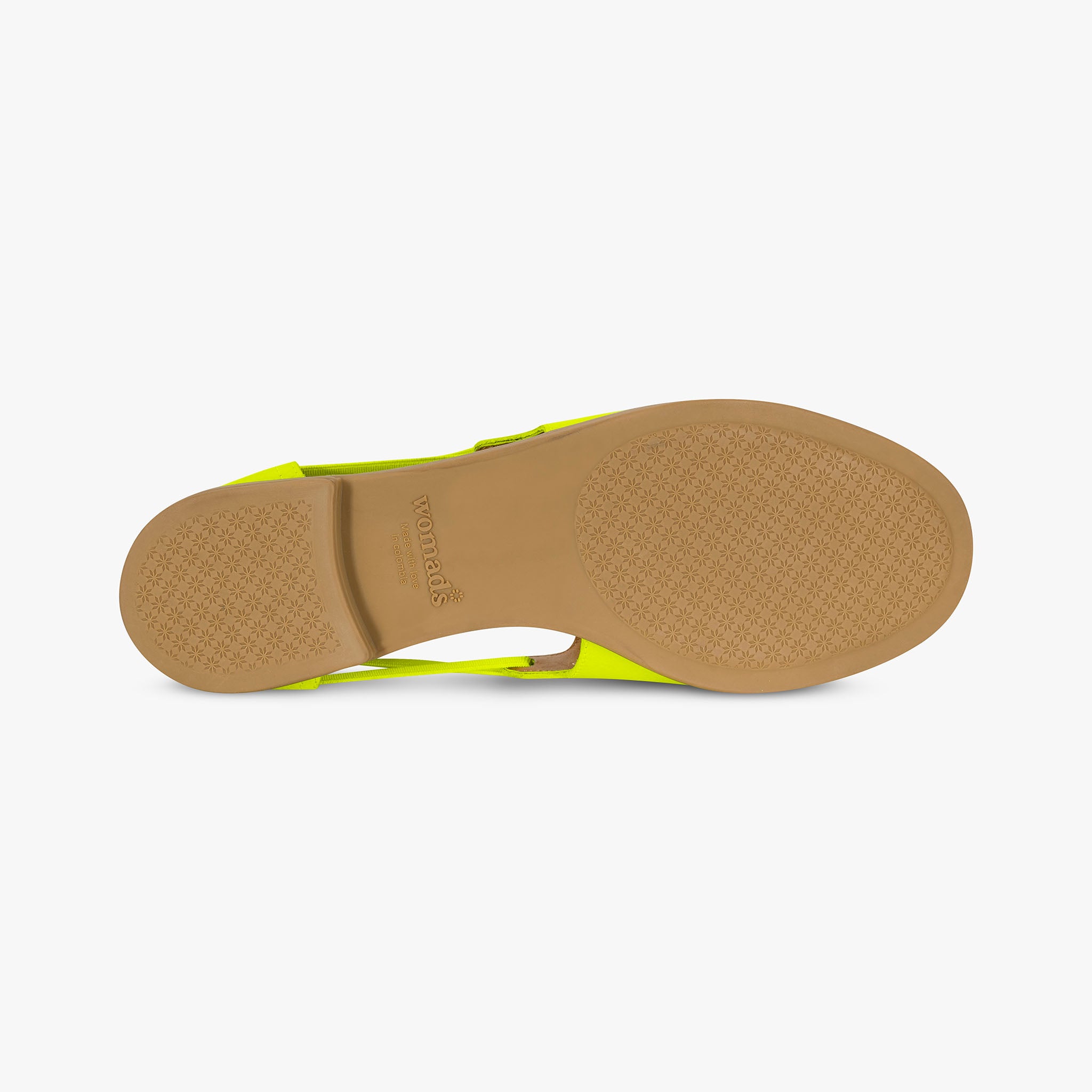 Sole of a sandal with a yellow strap on a white background