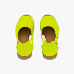 Pair of neon yellow shoes on a white background