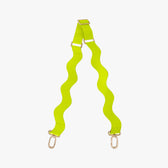 Neon green strap with wavy pattern and gold hardware on a white background