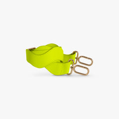 Neon green strap with gold hardware on a white background