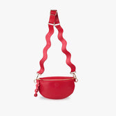 Red crossbody bag hanging from strap