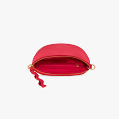 Red leather crossbody bag open to pink lining
