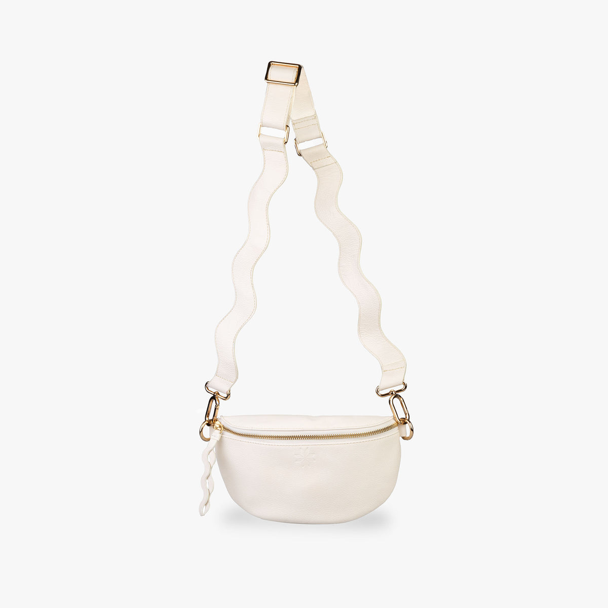 Cream Crossbody bag hanging from wavy strap