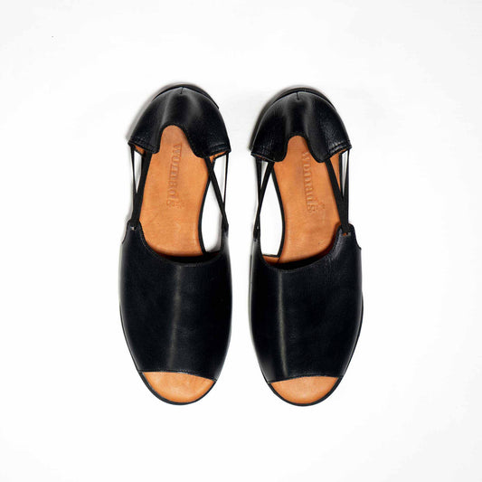 Womads black flat sandals top view
