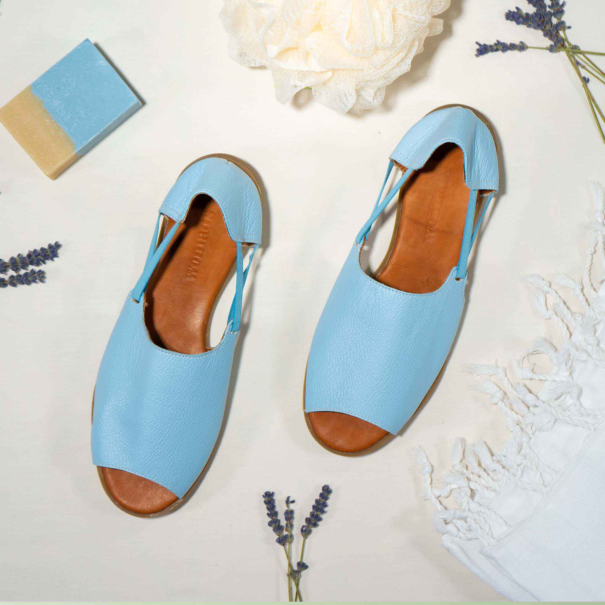 Womads blue sandals with spa props