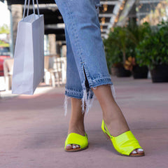 Womads lime green sandals close up