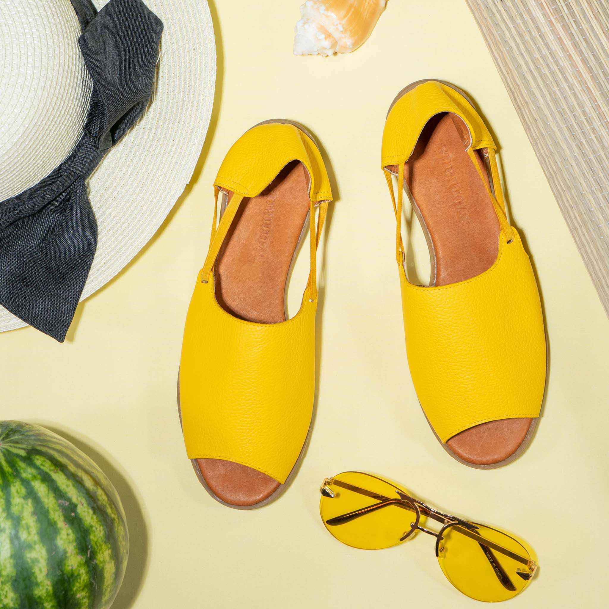 Womads yellow sandals with beach accessories