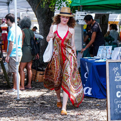 woman at farmers market wearing tan Womads