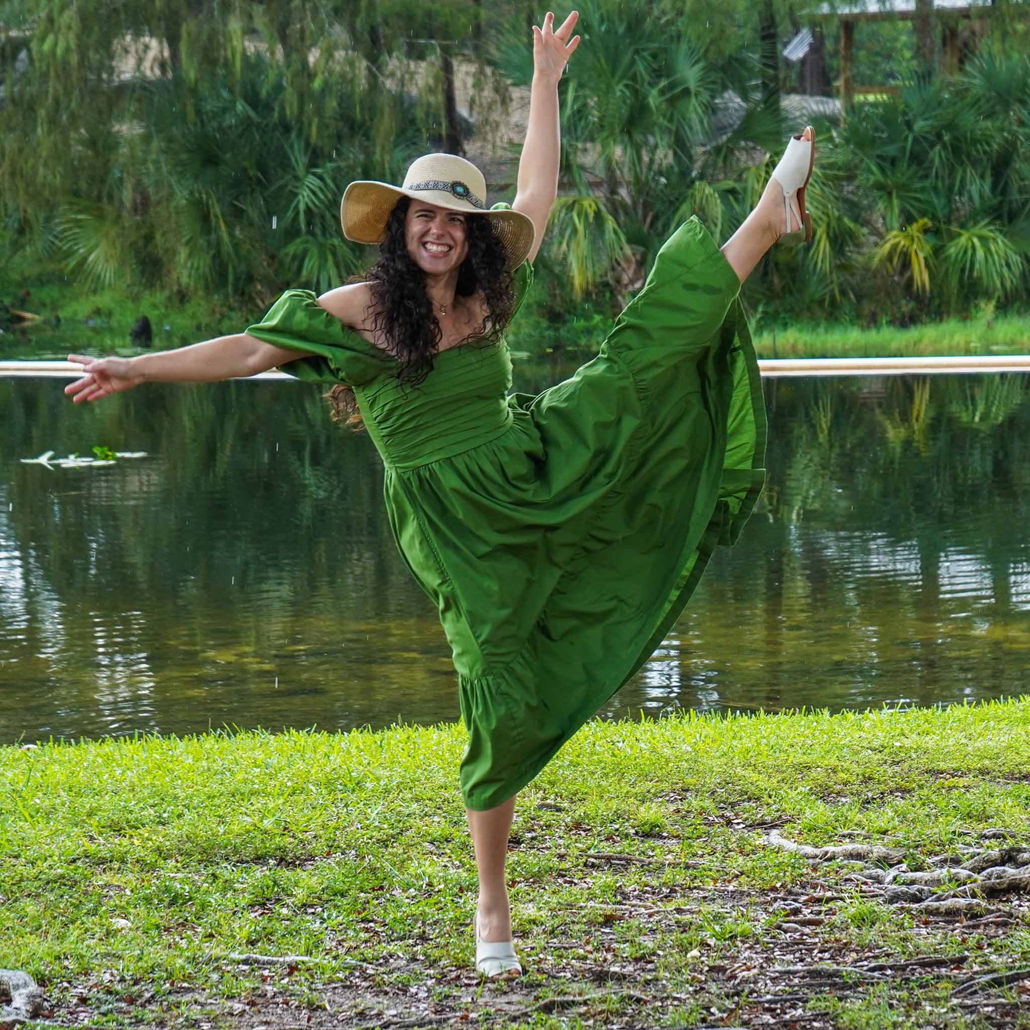 Woman dancing in her Green and Cream Womads sandals