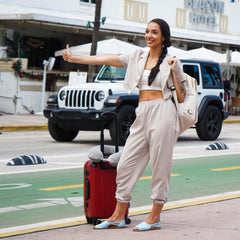 Woman traveling with womads blue sandals