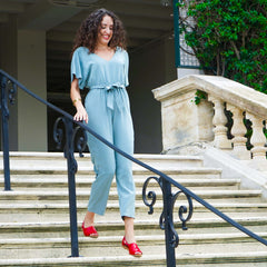 Woman walking in red Womads sandals